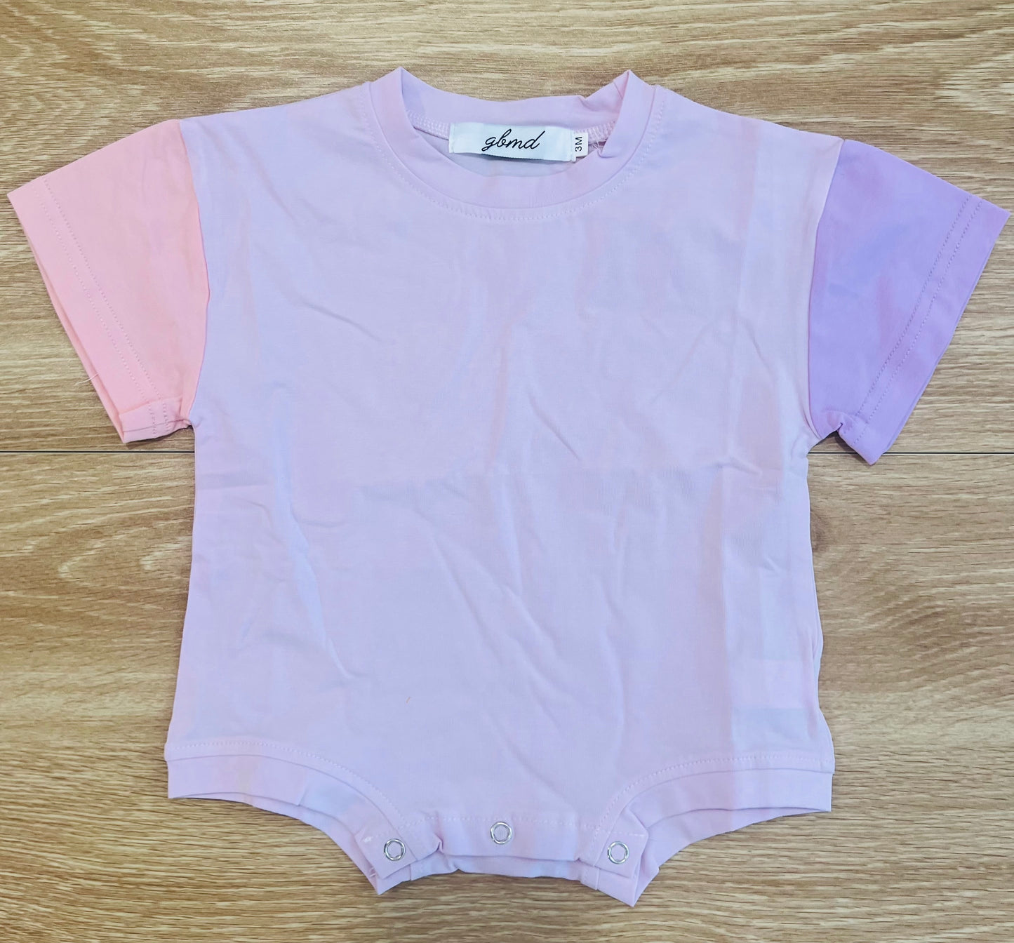 Pink romper with sleeves